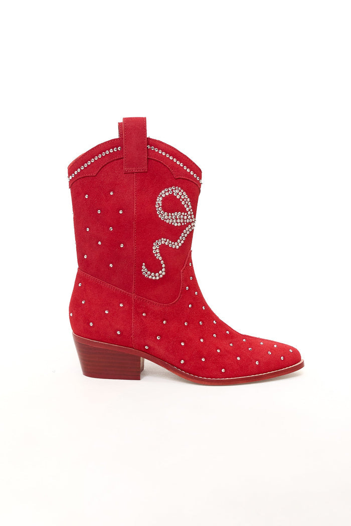 Step out in style with the Channing Bootie in Red by Ivy City Co—a pair of red suede cowboy booties featuring a low wooden heel, dazzling silver studs, and swirling rhinestone detailing. These western-inspired sparkly booties are the ultimate statement shoe.
