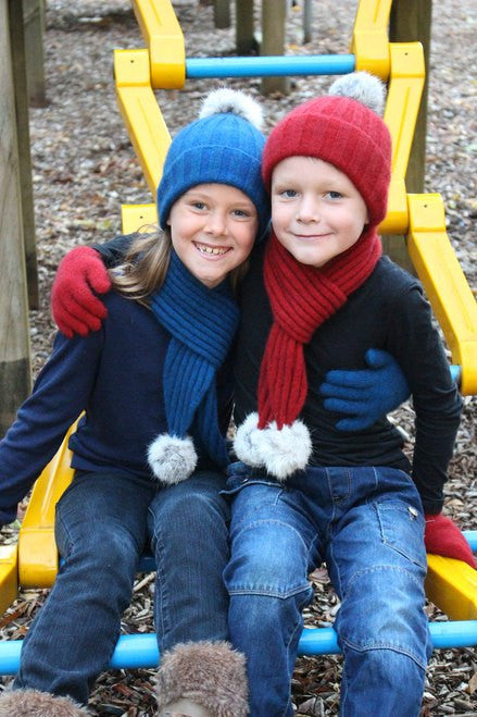 Girl wearing lagoon colour & boy wearing red colour scarf, beanie and glove set.