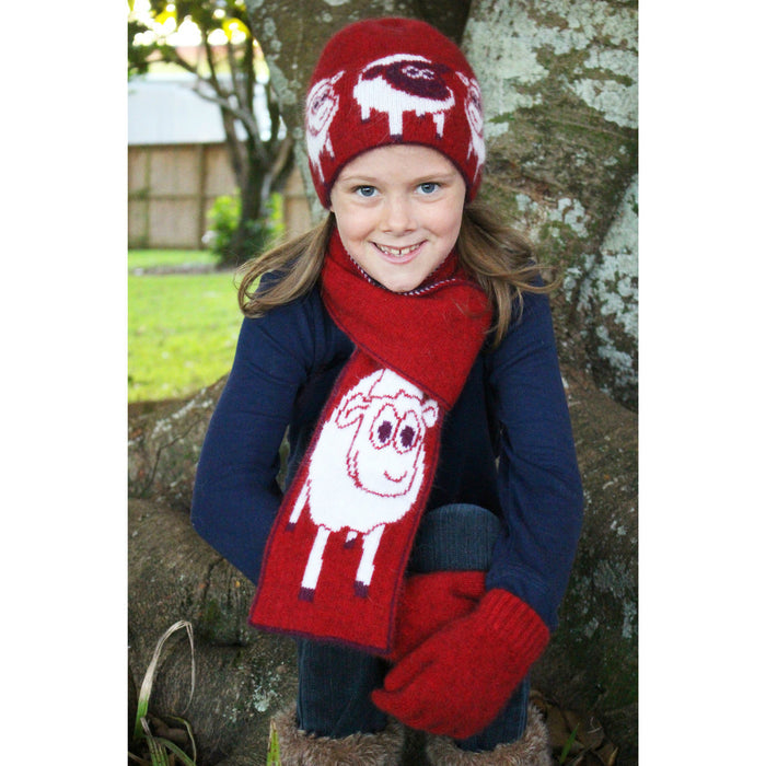 Girl sitting wearing scarf in colour red.