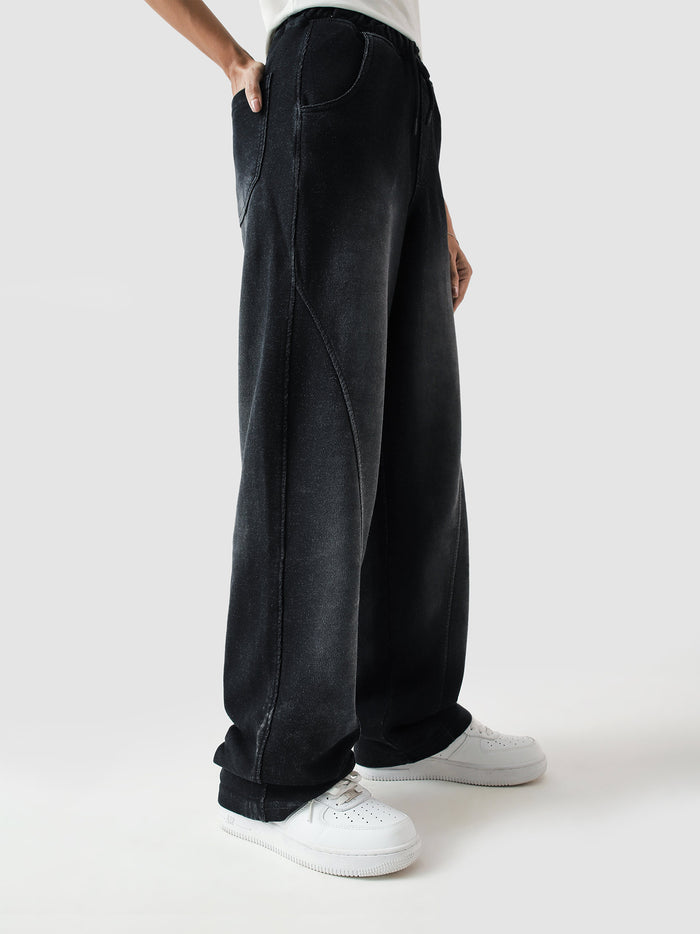 Fade washed trouser female model seated lifestyle shot Pakistan – GROOVY