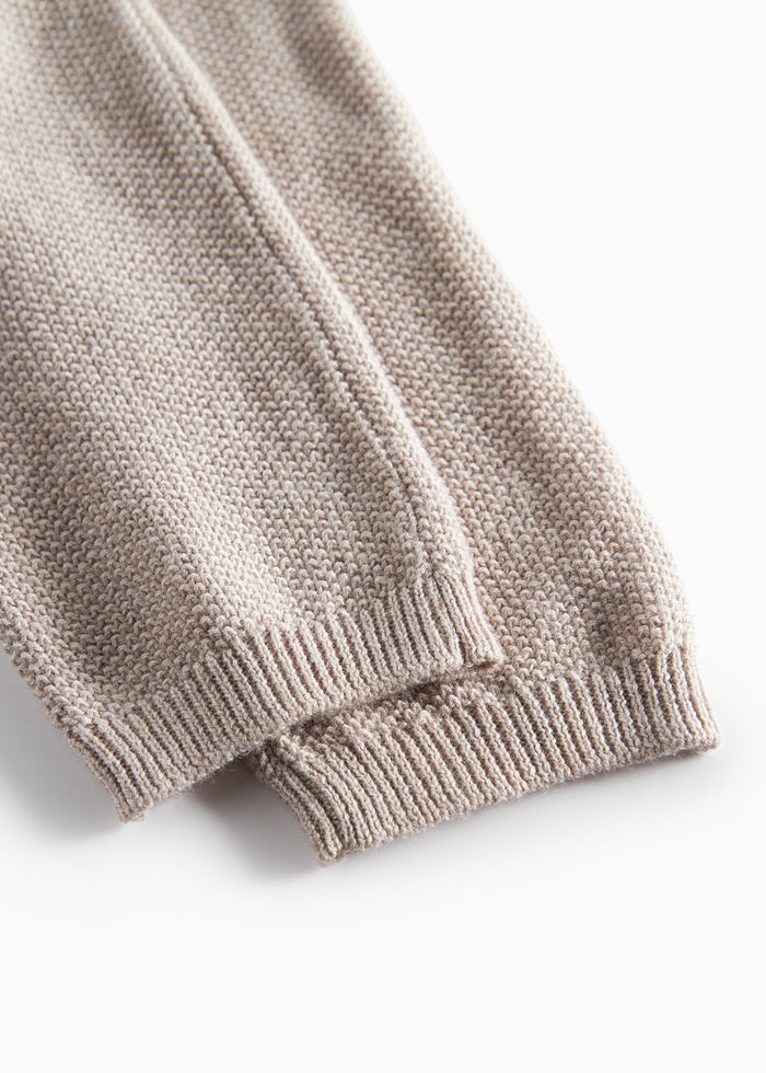 Close-up of beige knitted baby pants