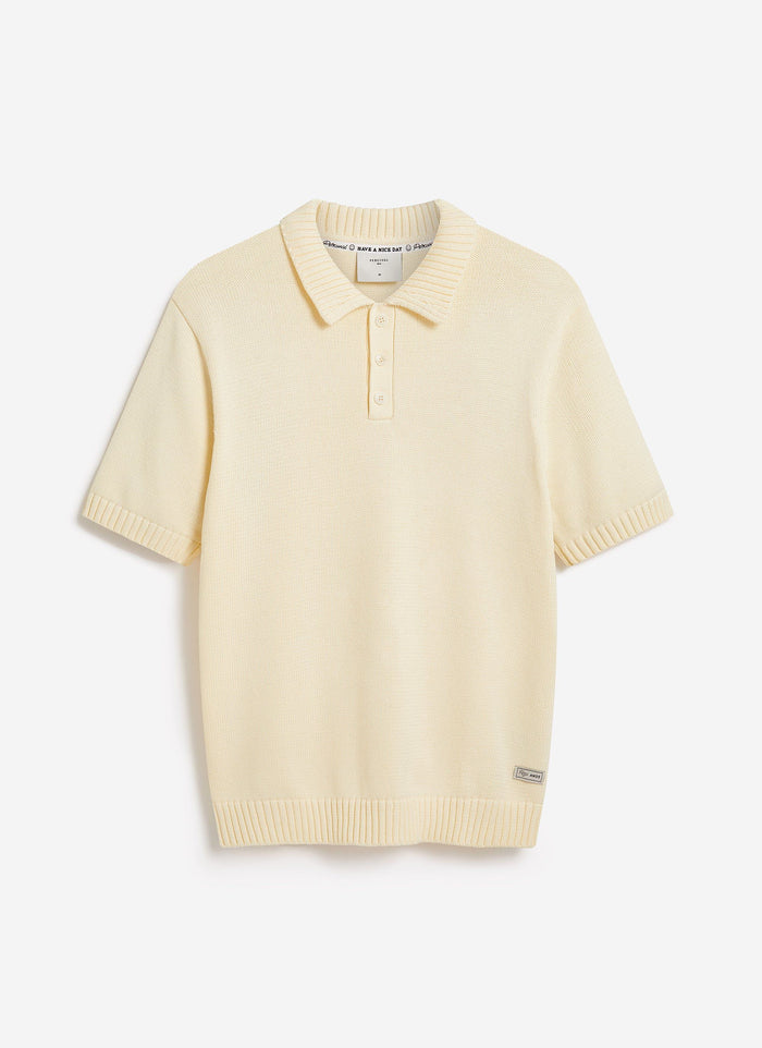 The Percival Verso Short Sleeve Knitted Shirt in ecru, a cotton polo shown flat against a clean white background.