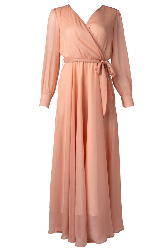 The Andie Dress in Apricot Crush by Ivy City Co features a peach-hued, long-sleeve maxi silhouette with a V-neck wrap design, belted waist, and flowing skirt—making it a stylish choice for the mother of the bride or an elegant maternity dress.