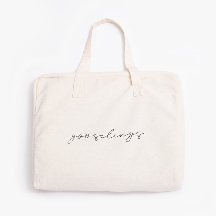Tote bag that is included in purchase, with the logo written across "gooselings"