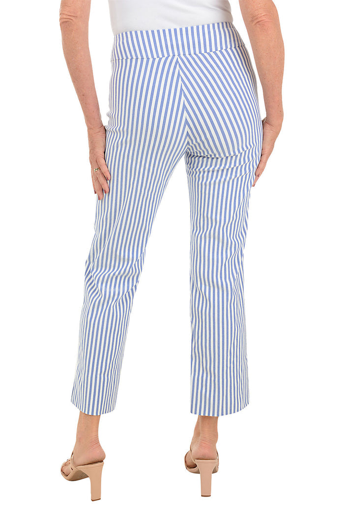 A back shot of a model wearing a pair of blue and white striped flared ankle pants with an elastic waistband, flat front and back, and side slits on the hemline.
