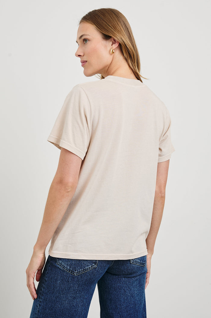 Boyfriend T-Shirt with a Crew Neck, Texas images, and the text, Texas, Don't Mess with Texas in Rails Texas Colorway, with text in orange and blue on Tan - Back View Featured on Model