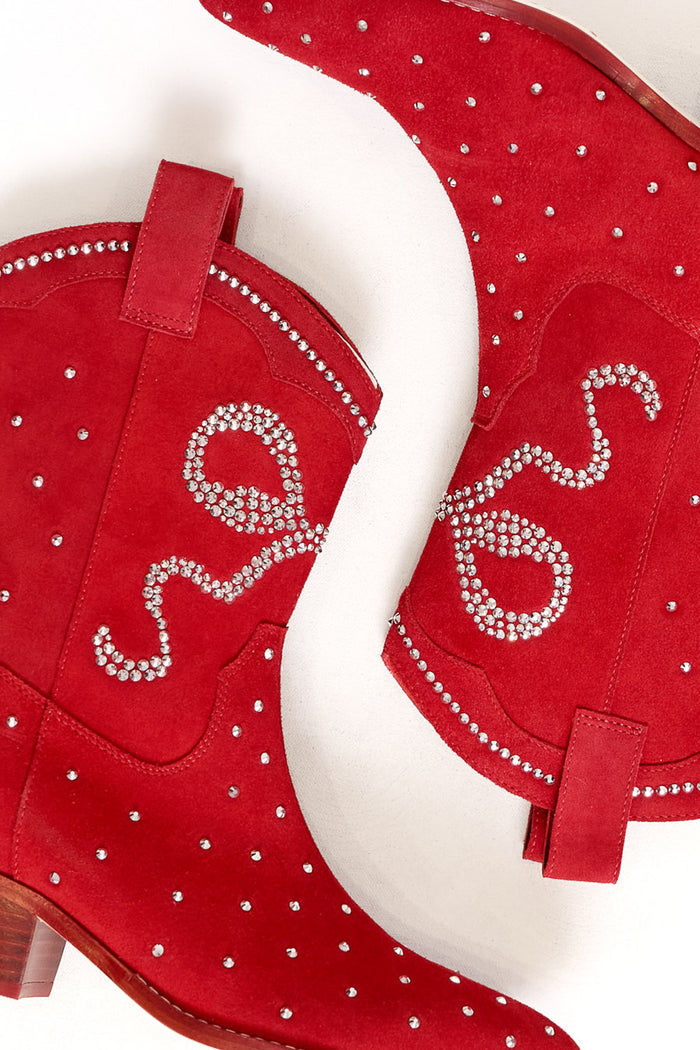 The Channing Bootie in Red by Ivy City Co features red suede, small silver studs, and crystal swirl embellishments on the sides. Both boots are displayed against a white background.