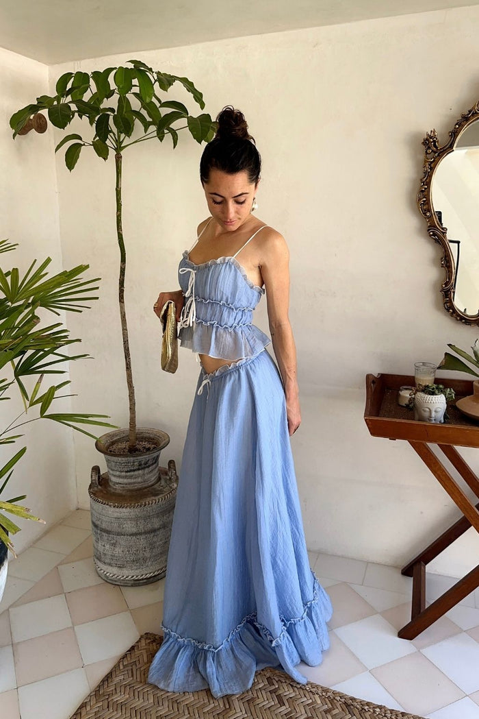 Lifestyle shot of the blue maxi skirt styled for day-to-night versatility.
