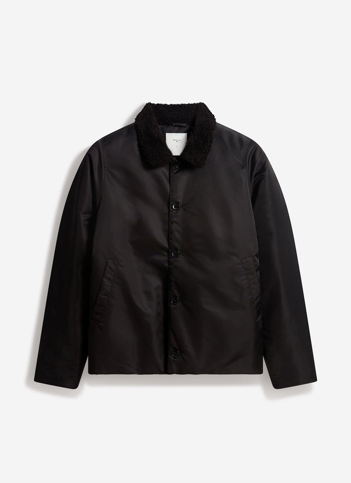 The Percival Doppio Bomber Jacket in black nylon, with a faux shearling collar, shot flat against a white background.