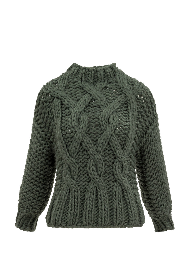 Green sweater against white background