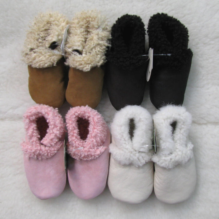 Babies’ lambskin booties in various colours.
