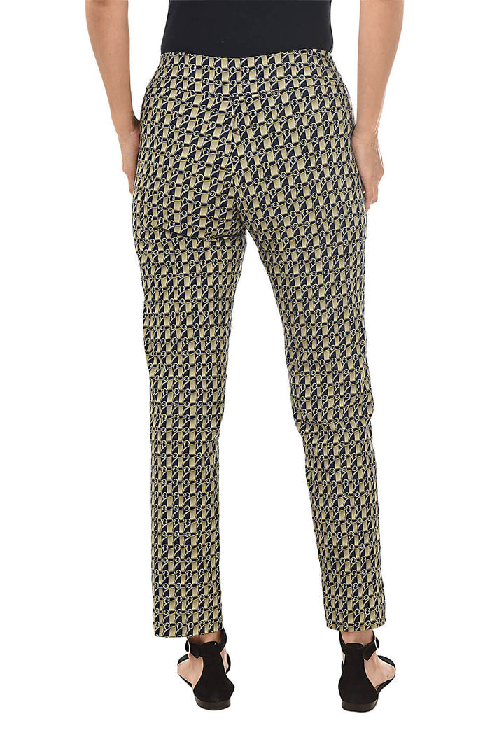 A back shot of a model wearing a pair of slim-fit golden link print pull-on ankle pants with an elasticized waistband, made from a blend of nylon, rayon, and spandex fabrics.