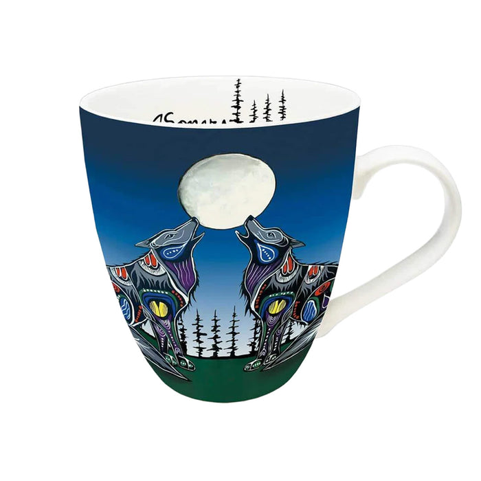 Mug with a design of two wolves under a moonlit sky on a blue background