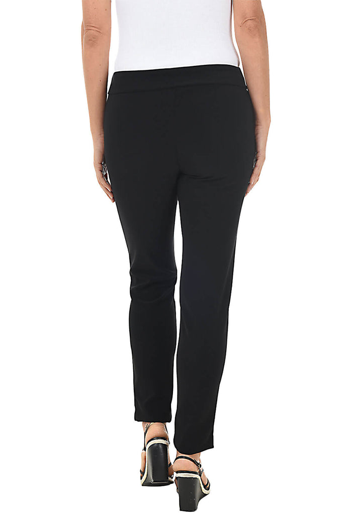 Back shot of model wearing black pants worn by a person on a white background