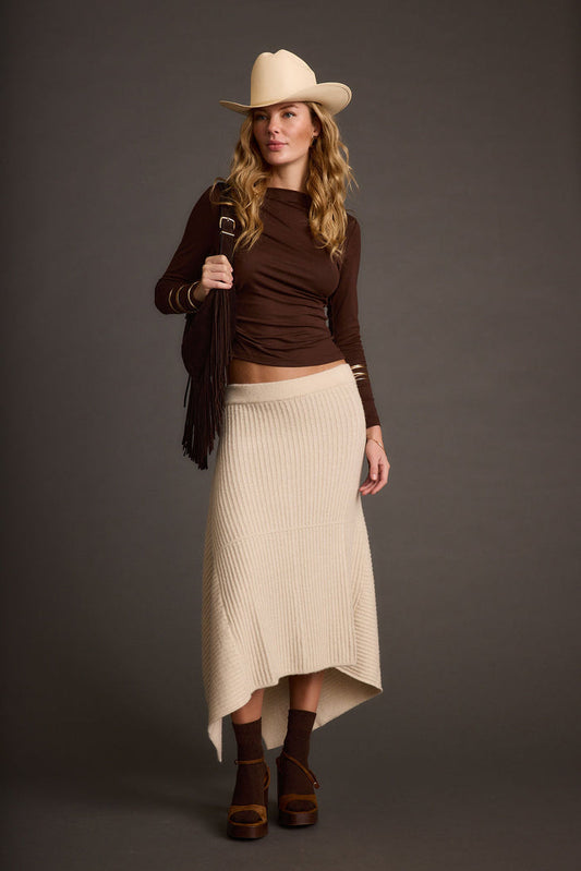 Cream skirt with refined detailing and a flattering silhouette.