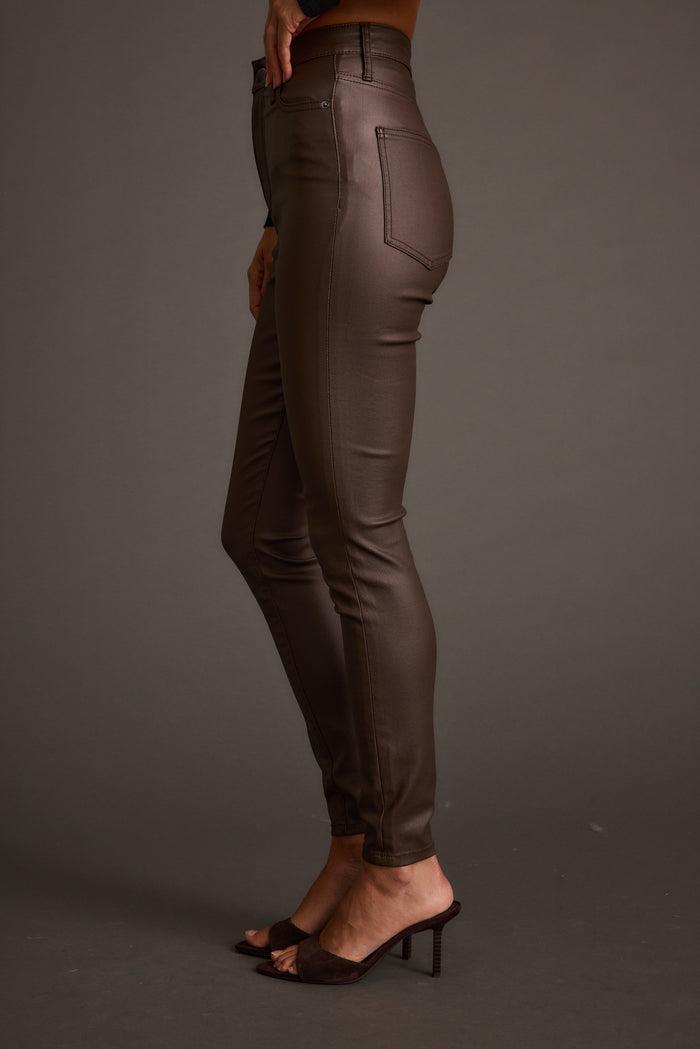 Nixon Mocha Coated Pants paired with complementary accessories for a polished look.