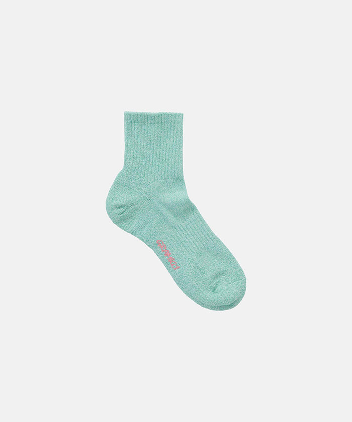 Emerald Gramicci Paper Mix Sock against a light-tone background.