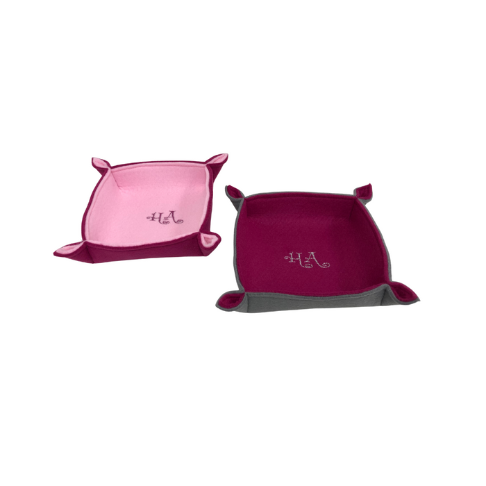Pink and burgundy felt trays with embroidered HA detailing.