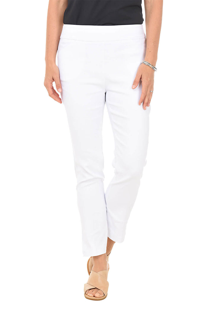 A front shot of a model wearing a pair of white ankle pants with an elastic waistband, dual front pockets, and side slits on the hemline. The pants are pull-on style with no visible zipper.