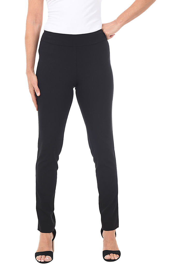A front shot of a model wearing black pull-on slim full-length pants with a slim leg, paired with a white top and black shoes.