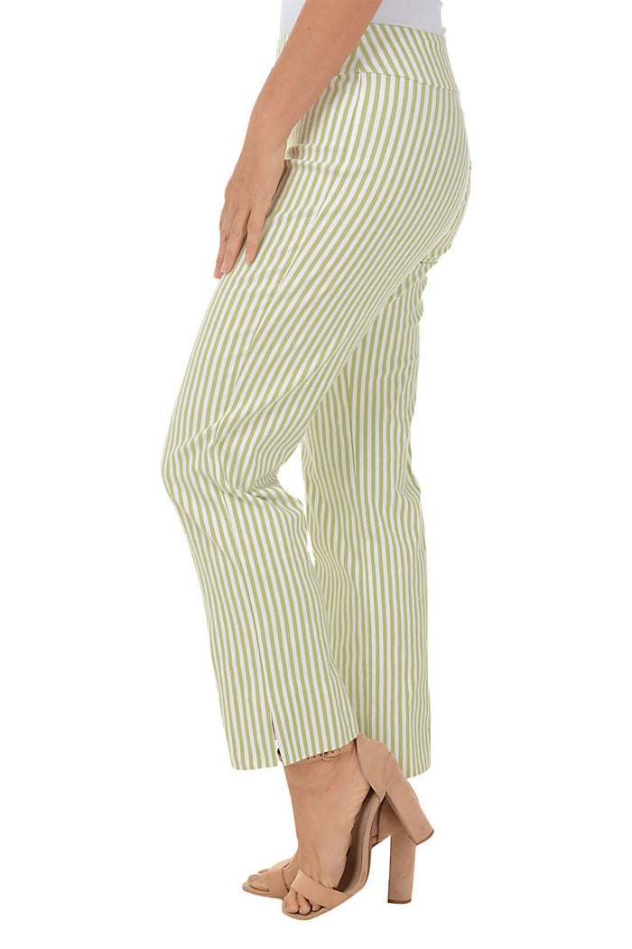 A side shot of a model wearing a pair of green striped flared ankle pants with an elastic waistband, flat front and back, and side slits on the hemline.