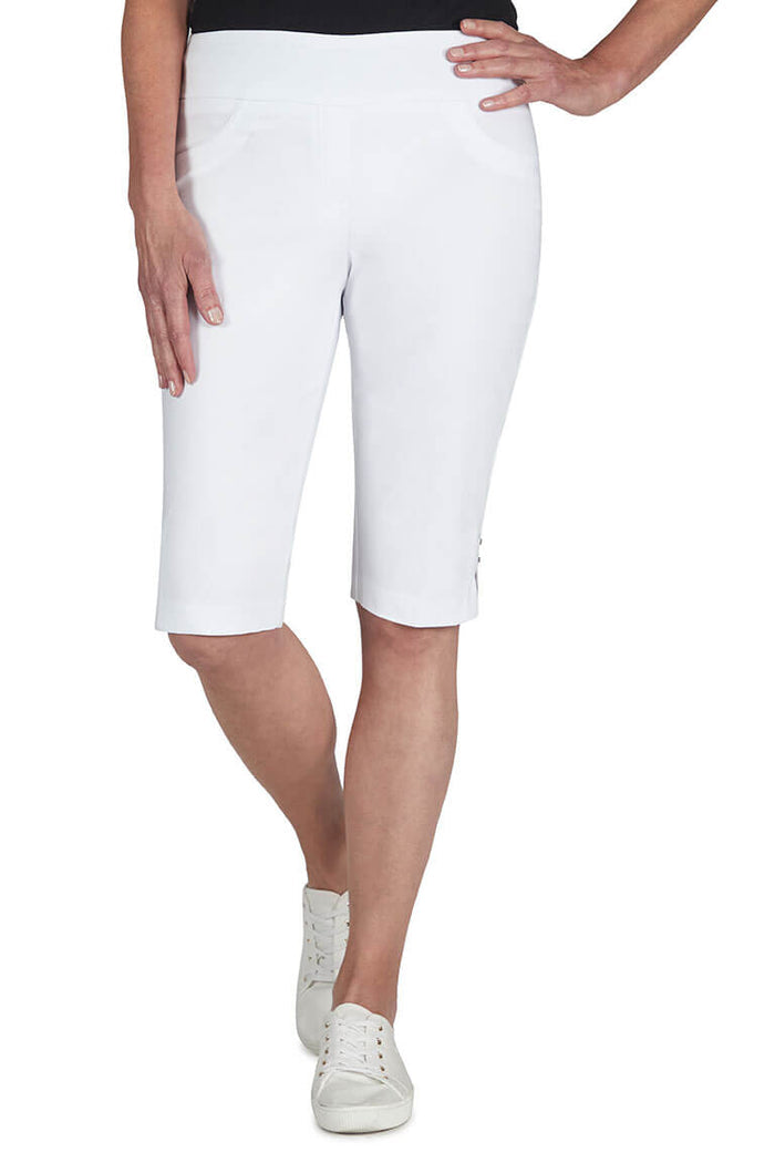 Person wearing white shorts on a white background